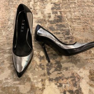 L. A. M. B. Metallic silver and black pumps.